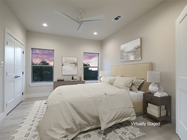 bedroom featuring light hardwood / wood-style flooring and ceiling fan