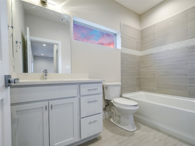 full bathroom with tiled shower / bath combo, tile flooring, oversized vanity, and toilet