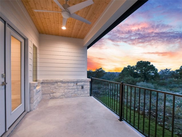 balcony at dusk with ceiling fan