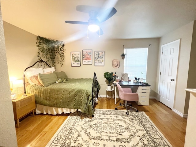 bedroom with light hardwood / wood-style floors and ceiling fan