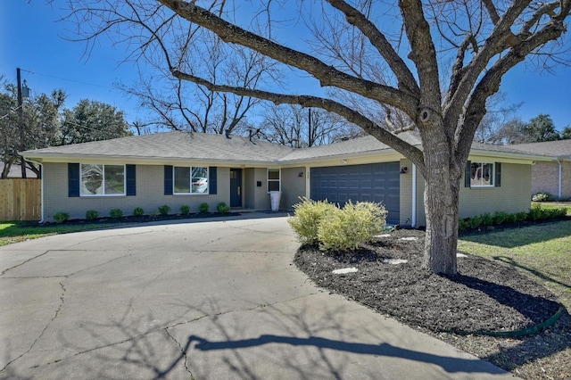 ranch-style house featuring a garage