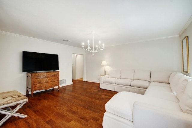 living room with crown molding, a notable chandelier, and dark hardwood / wood-style floors