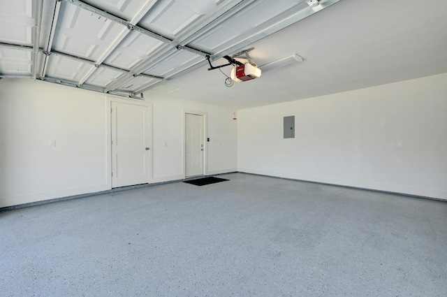 garage featuring a garage door opener and electric panel