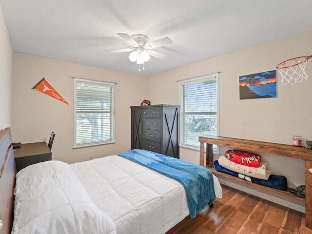 bedroom with ceiling fan and wood-type flooring