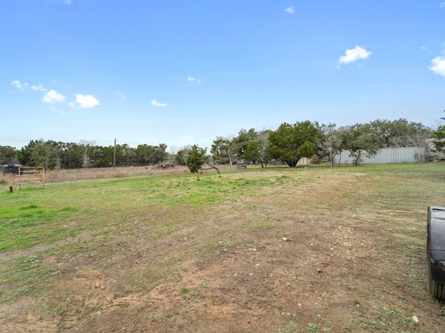 view of yard with a rural view