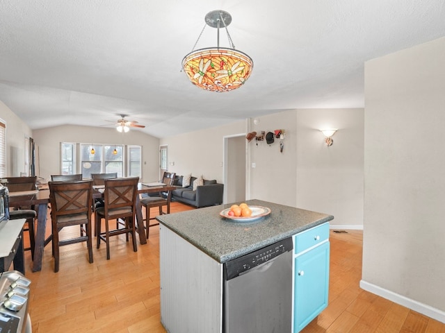 kitchen featuring blue cabinetry, dishwasher, light hardwood / wood-style flooring, and vaulted ceiling