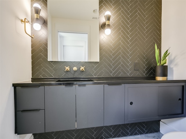 bathroom with backsplash, tile floors, and vanity