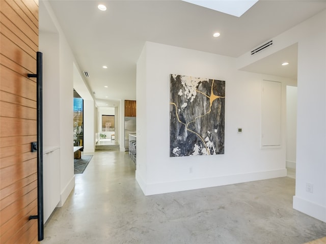 hallway with a skylight