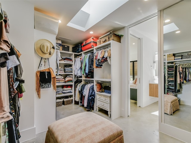 spacious closet with a skylight