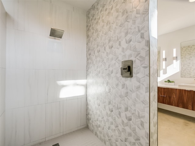 bathroom with walk in shower and vanity