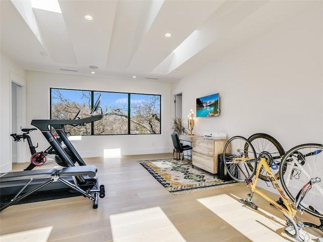 exercise area featuring hardwood / wood-style floors