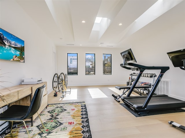 workout area featuring light wood-type flooring