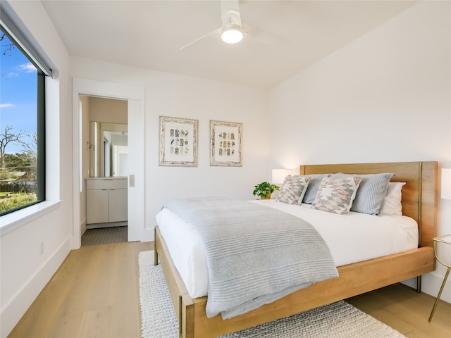 bedroom with ceiling fan and light wood-type flooring