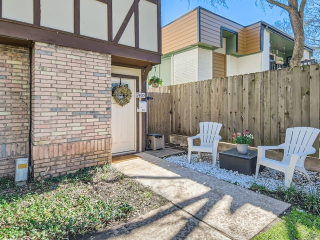 entrance to property featuring a patio area