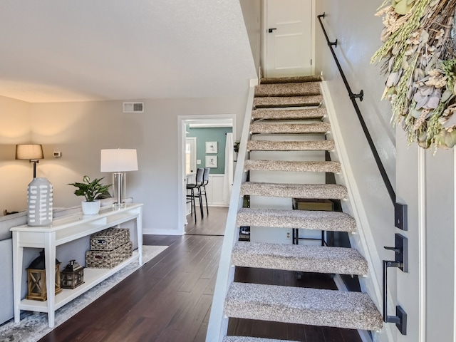 stairs with wood-type flooring