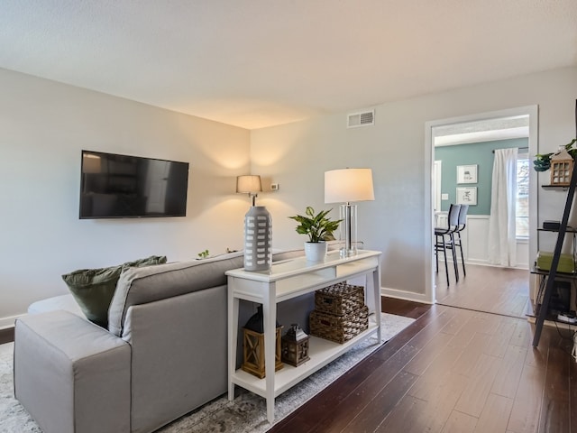 living room featuring dark wood-type flooring