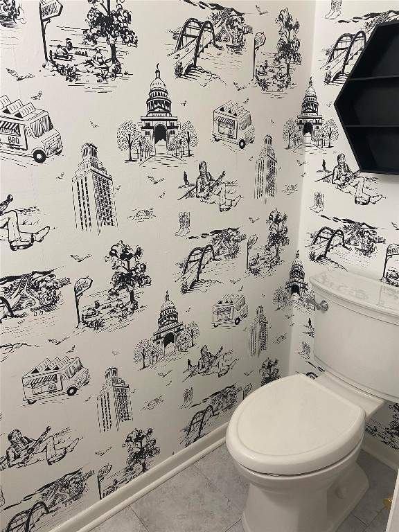 bathroom featuring toilet and tile patterned floors