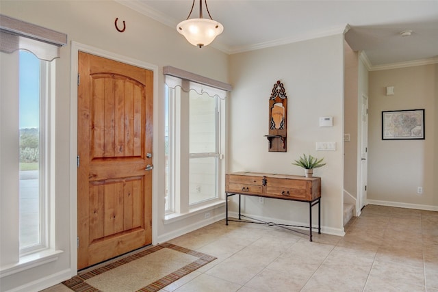 entryway with ornamental molding, a healthy amount of sunlight, and light tile patterned flooring