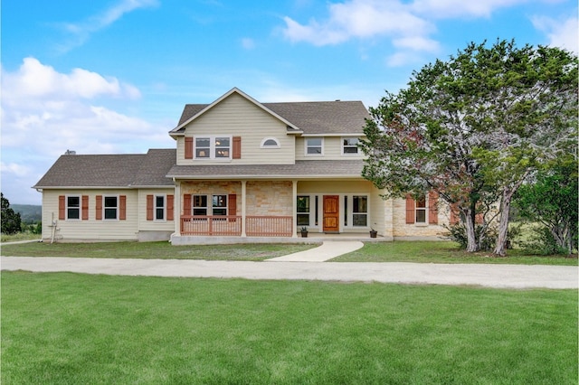 view of front facade featuring a porch and a front lawn