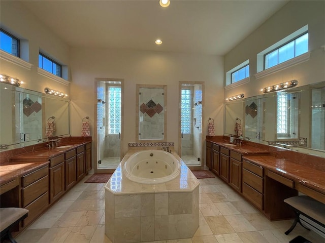 bathroom with vanity and plus walk in shower