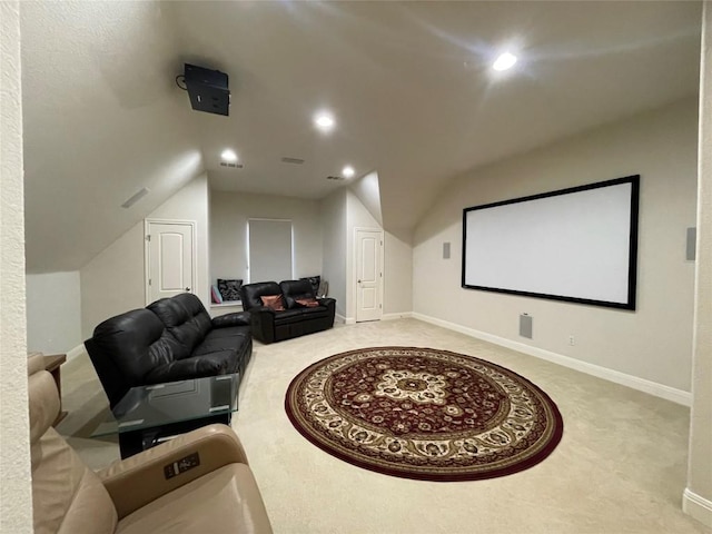 carpeted cinema featuring lofted ceiling