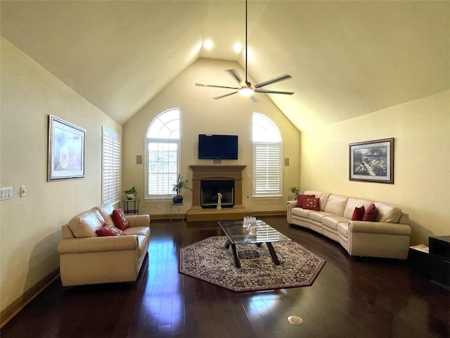 living room with vaulted ceiling, ceiling fan, and dark hardwood / wood-style floors