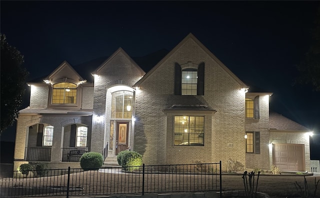 french country style house with a garage