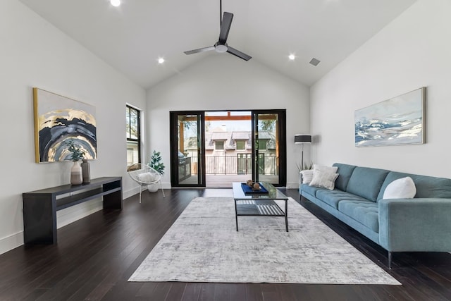 living room featuring ceiling fan, dark wood-type flooring, and high vaulted ceiling