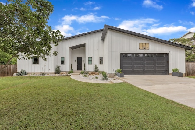 modern farmhouse style home featuring a front lawn and a garage