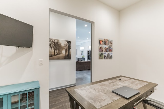 office space with dark hardwood / wood-style flooring