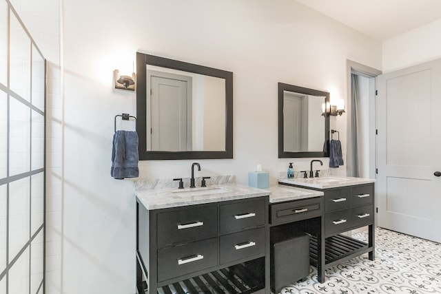 bathroom with tile flooring, large vanity, and dual sinks