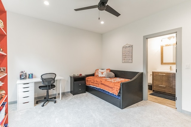 bedroom with ceiling fan and light carpet