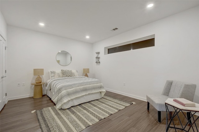 4361 S Congress Ave Unit 408, Austin, TX 78745 - bedroom with baseboards, wood finished floors, and recessed lighting