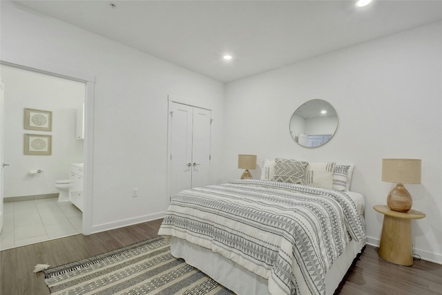 bedroom featuring tile flooring and ensuite bathroom