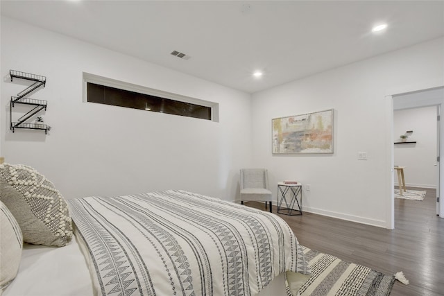 4361 S Congress Ave Unit 408, Austin, TX 78745 - bedroom with recessed lighting, wood finished floors, and baseboards