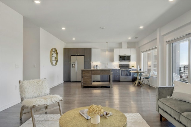 4361 S Congress Ave Unit 408, Austin, TX 78745 - living room with baseboards, recessed lighting, and dark wood finished floors