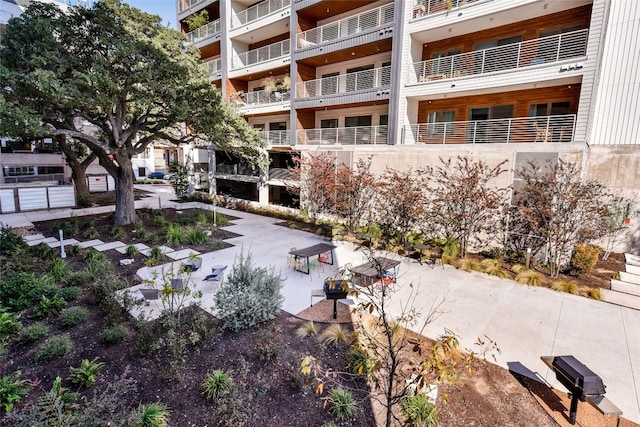 view of property's community featuring a patio area