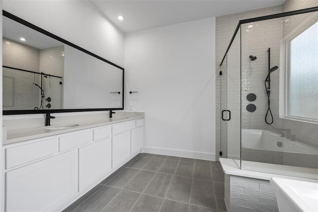 bathroom with tile patterned flooring, vanity, and a shower with door