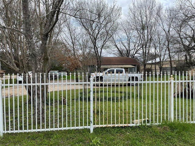 view of gate featuring a lawn