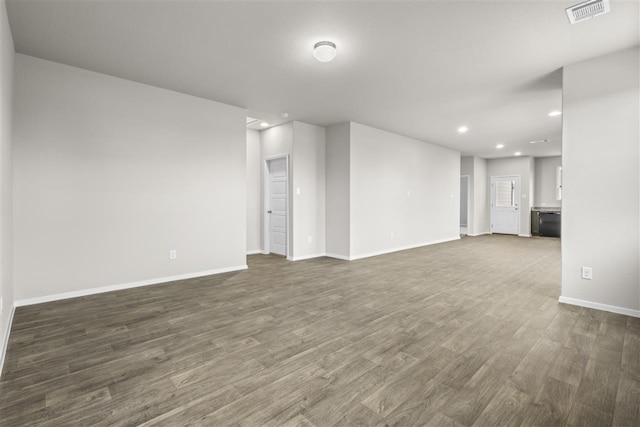 unfurnished living room featuring dark hardwood / wood-style flooring