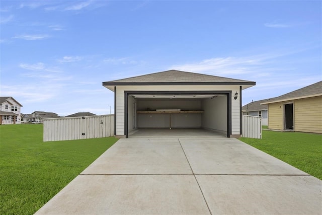 garage featuring a lawn