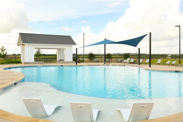 view of pool featuring a patio