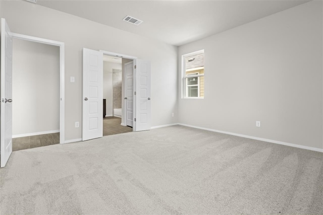 unfurnished bedroom featuring dark carpet