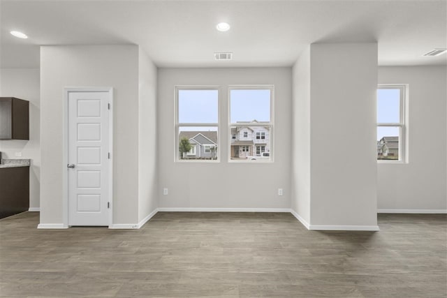 unfurnished living room featuring light hardwood / wood-style flooring