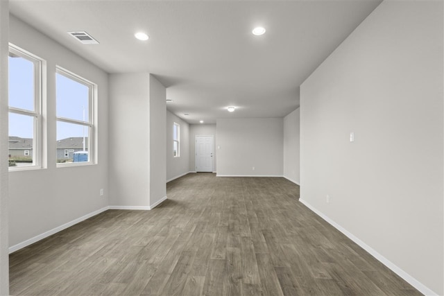 spare room with wood-type flooring