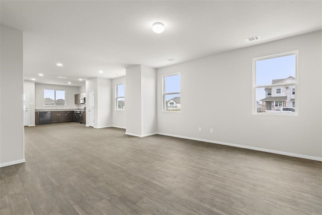 unfurnished living room featuring wood-type flooring