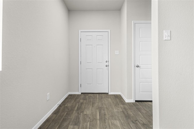 corridor featuring dark hardwood / wood-style floors