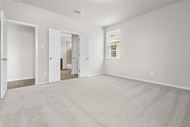 unfurnished bedroom featuring dark colored carpet