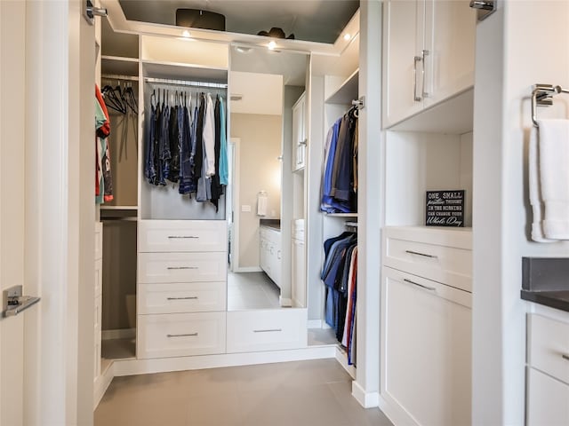 spacious closet featuring light tile floors