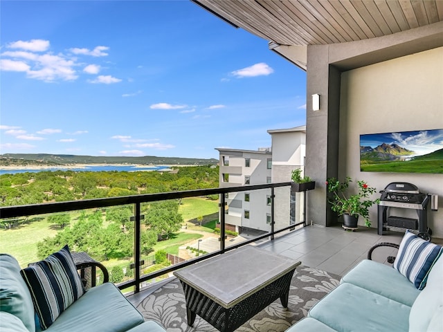 balcony featuring a water view